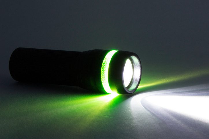 Polk Electric LLC | Black Flashlight, Beam from flashlight on a paper